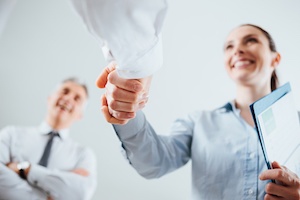 top job candidate shaking employers hand
