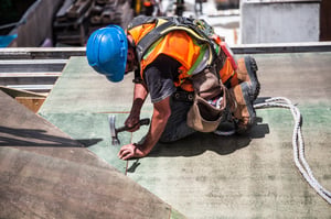 construction worker takes safety precautions to prevent injury during National Safety Month