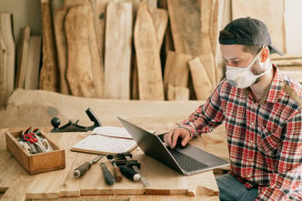 Carpenter wears mask to protect himself from dust inhalation and COVID-19