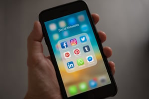 iphone with social media app icons
