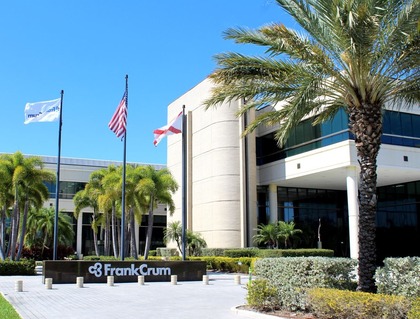 The company's headquarters: a modern office building with a sleek exterior design, prominently featuring the company logo.