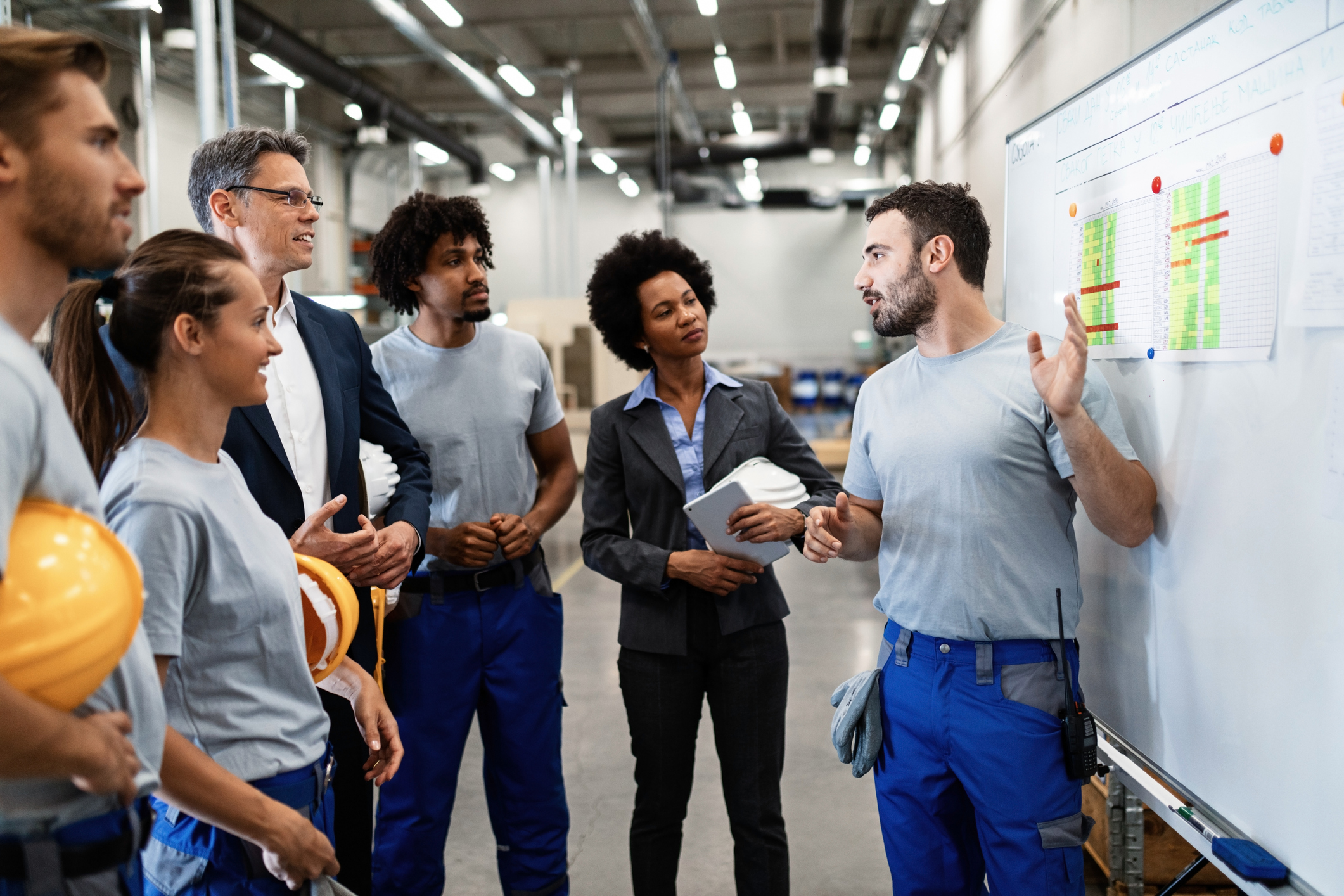 Worker conducts a training session with employees.